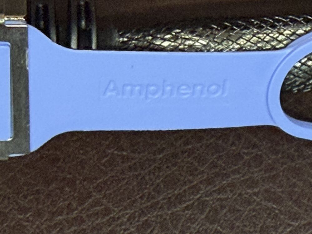 Amphenol name embossed on the blue pull tab of a QSFP112 400G DAC cluster cable connector